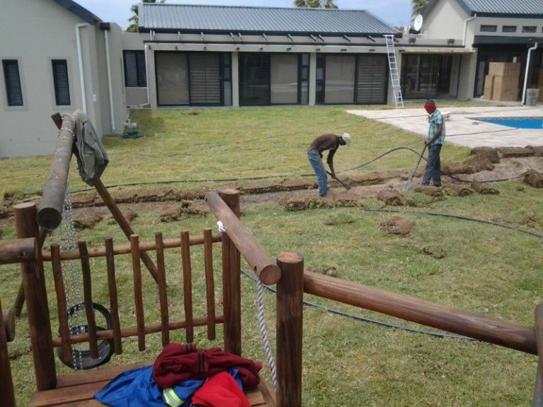 Large landscaped lawn area 03 laying around jungle gym and pool 