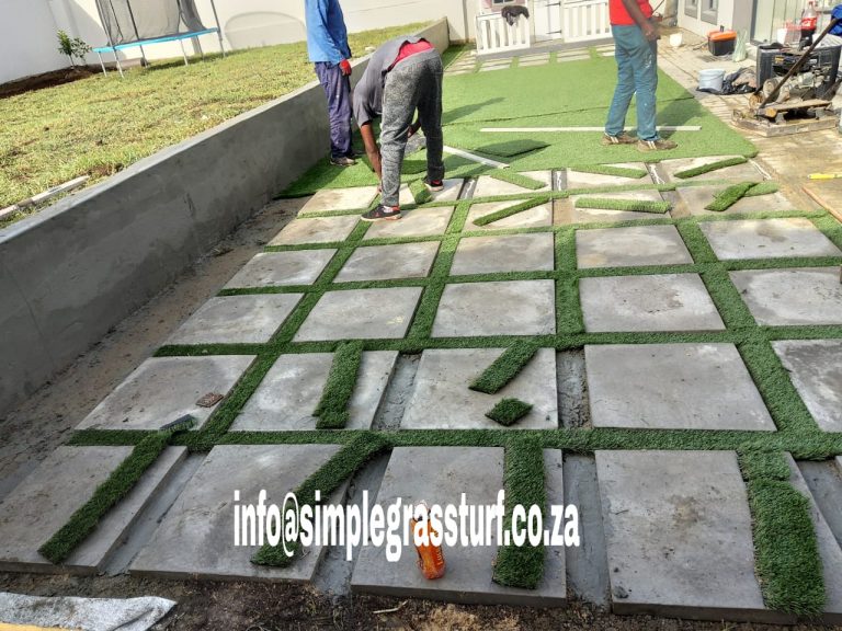 06 garden projects artificial grass cobble slabs during installaion 